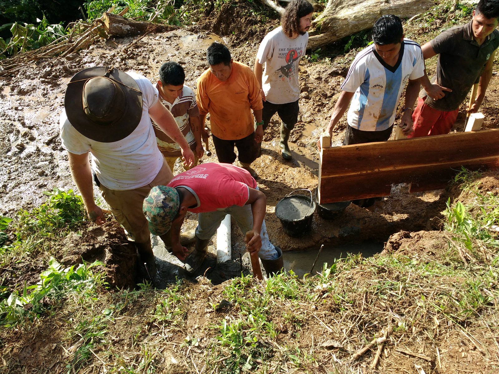 Samuel D. Hodges and team on on-site spring capture construction in Ecuador